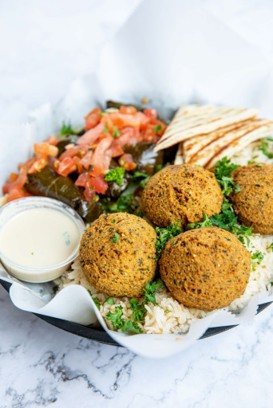 Crispy falafel served with fresh Mediterranean sides at Pita Corner