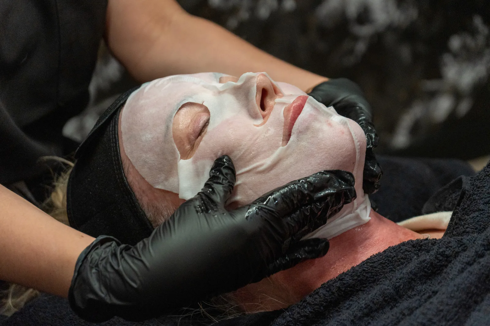 Patient receiving a professional facial treatment. 